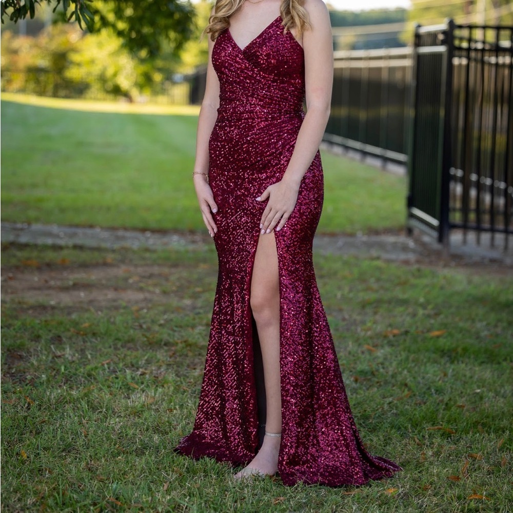 Stunning burgundy formal dress. Form-fitting, flattering, and comfortable.